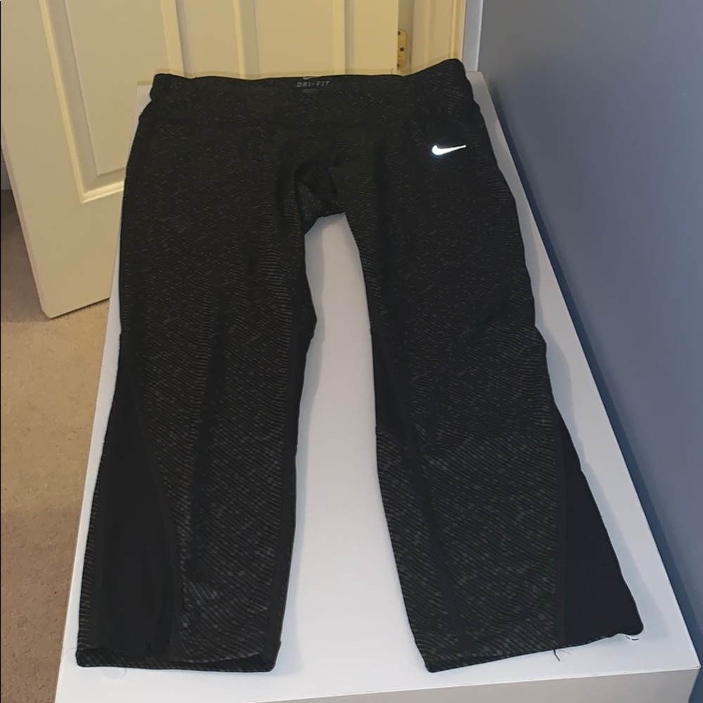 printed cropped leggings, reflective nike symbol